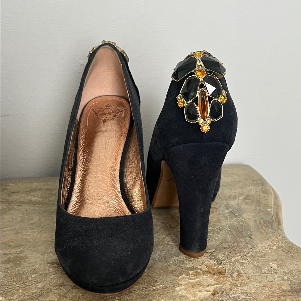 Miss Albright Specialty navy suede pumps with gemstone embellishments.